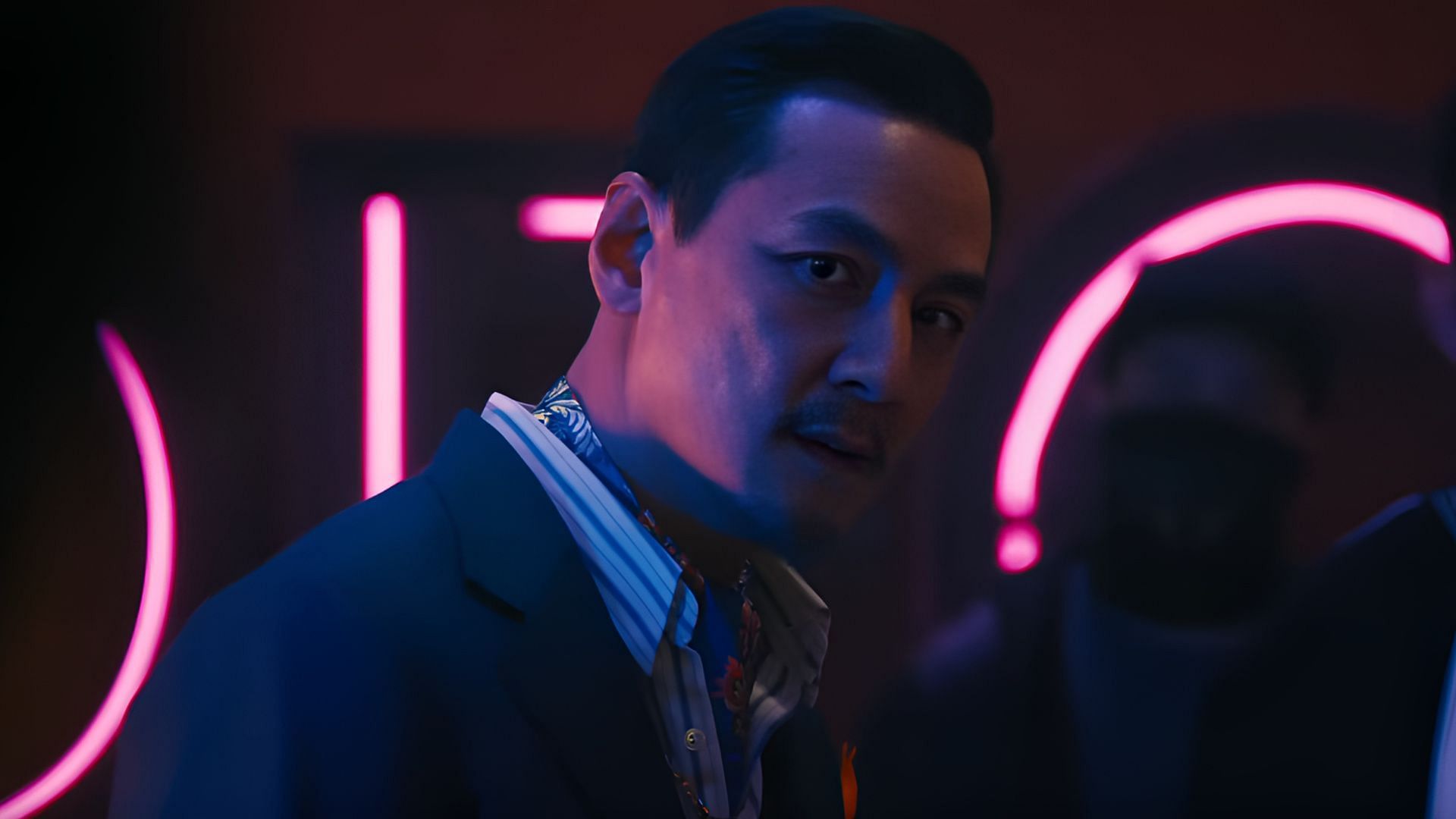 Knuckles stares down his enemies in Love Hurts, unaware that betrayal from within his own ranks is about to bring his empire down. ( Image via Universal Pictures)